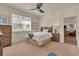 Cozy bedroom with a comfortable bed, wooden furniture, and a window with natural light at 5741 Echo Park Cir, Castle Rock, CO 80104