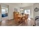 Inviting dining room with natural light, wooden table and chairs, and access to the outdoor space at 5741 Echo Park Cir, Castle Rock, CO 80104