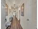 Inviting entryway with modern lighting, decor, wood flooring, and neutral paint throughout at 5741 Echo Park Cir, Castle Rock, CO 80104