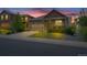 Charming single-Gathering home featuring a stone facade, well-maintained lawn, and a two-car garage at 5741 Echo Park Cir, Castle Rock, CO 80104