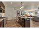 Modern kitchen featuring granite countertops, dark cabinets, and stainless steel appliances at 5741 Echo Park Cir, Castle Rock, CO 80104