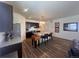 Modern kitchen featuring a large island with seating, sleek dark cabinetry and stainless steel appliances at 5741 Echo Park Cir, Castle Rock, CO 80104