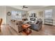 Bright living room featuring hardwood floors, neutral decor, and a cozy fireplace at 5741 Echo Park Cir, Castle Rock, CO 80104