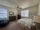 Inviting main bedroom with ceiling fan, carpeted floors, window, dresser, and soft, natural light at 5741 Echo Park Cir, Castle Rock, CO 80104