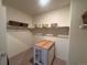 Well-organized walk-in closet with shelving, storage baskets, and central organizing island at 5741 Echo Park Cir, Castle Rock, CO 80104