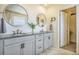 Stylish bathroom features dual sinks with granite countertops, modern fixtures, and ample cabinet space at 8078 S Yantley Ct, Aurora, CO 80016