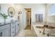 Luxurious bathroom featuring a soaking tub, granite countertops, and access to a walk-in closet at 8078 S Yantley Ct, Aurora, CO 80016