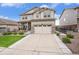 Charming two-story home with stone accents, well-maintained lawn, and a spacious two-car garage at 8078 S Yantley Ct, Aurora, CO 80016