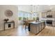 Bright, open kitchen with a large center island, granite countertops, stainless steel appliances, and a dining area at 8078 S Yantley Ct, Aurora, CO 80016