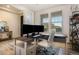 Bright home office featuring wood floors, a large window, and a modern desk setup perfect for remote work at 8078 S Yantley Ct, Aurora, CO 80016