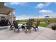 Spacious patio with outdoor seating and a view of the green yard, perfect for entertaining at 8078 S Yantley Ct, Aurora, CO 80016