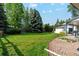 Well-maintained backyard featuring lush green lawn at 1998 S Harlan Ct, Lakewood, CO 80227