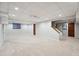 Spacious basement featuring ample room for entertaining or relaxing with neutral colors at 1998 S Harlan Ct, Lakewood, CO 80227