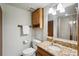 Bathroom featuring a vanity with a granite countertop and modern fixtures at 1998 S Harlan Ct, Lakewood, CO 80227