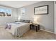 Bright bedroom featuring neutral colors, soft carpet, and ample natural light at 1998 S Harlan Ct, Lakewood, CO 80227