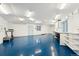 Spacious garage with epoxy floors and ample lighting at 1998 S Harlan Ct, Lakewood, CO 80227