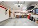 Organized garage featuring a workbench and storage solutions at 1998 S Harlan Ct, Lakewood, CO 80227