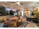 Relaxing covered patio with stylish outdoor dining area, comfortable seating, and a view of the spacious backyard at 1998 S Harlan Ct, Lakewood, CO 80227