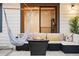 Comfortable outdoor seating area with a cozy fire pit and hammock, perfect for relaxing and entertaining guests at 1998 S Harlan Ct, Lakewood, CO 80227