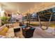 Relaxing backyard patio featuring comfortable seating and a fire pit at 1998 S Harlan Ct, Lakewood, CO 80227