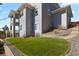 Backyard featuring manicured green space, retaining wall, and architectural details on the house at 20132 Spruce Point Pl, Parker, CO 80134