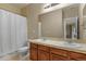 Bathroom with double sinks, a shower/tub combination, and framed mirrors at 20132 Spruce Point Pl, Parker, CO 80134