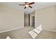 A cozy bedroom with neutral carpet, light-colored walls, and a ceiling fan for added comfort at 20132 Spruce Point Pl, Parker, CO 80134