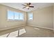 Spacious bedroom with large windows, neutral walls and carpet, and a ceiling fan at 20132 Spruce Point Pl, Parker, CO 80134