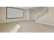 Finished bonus room featuring neutral carpet, and a blank projector screen at 20132 Spruce Point Pl, Parker, CO 80134