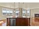 Kitchen island featuring granite countertops and stainless steel appliances overlooking dining area at 20132 Spruce Point Pl, Parker, CO 80134