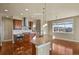 Gourmet kitchen featuring an island with granite countertops and stainless steel appliances at 20132 Spruce Point Pl, Parker, CO 80134