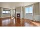 Bright living room featuring a cozy fireplace and large windows with scenic views at 20132 Spruce Point Pl, Parker, CO 80134