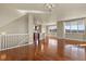 Open-concept living space with hardwood floors seamlessly flowing into kitchen and dining area at 20132 Spruce Point Pl, Parker, CO 80134