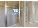 Features a glass shower with a tiled surround and a shower head at 20132 Spruce Point Pl, Parker, CO 80134