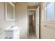 Bright bathroom with large mirror and vanity and a tiled floor at 3765 S Depew St, Denver, CO 80235