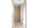 Tiled shower in a bright bathroom space, along with toilet, tile flooring and window at 3765 S Depew St, Denver, CO 80235