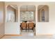 Open-concept dining room with ample natural light and modern furnishings at 3765 S Depew St, Denver, CO 80235