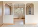 Spacious dining room with hardwood floors and views of the backyard at 3765 S Depew St, Denver, CO 80235