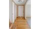 Welcoming foyer featuring hardwood floors, a white front door, and neutral-toned walls at 3765 S Depew St, Denver, CO 80235