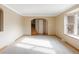Bright living room with neutral carpeting and trim plus lots of natural light at 3765 S Depew St, Denver, CO 80235