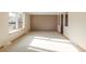 Bright living room with neutral carpeting and trim plus lots of natural light at 3765 S Depew St, Denver, CO 80235