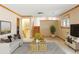 Open living room with staircase and views to the lower level, perfect for entertaining at 3765 S Depew St, Denver, CO 80235