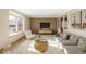 Cozy living room with a large bay window, comfortable seating, and stylish decor at 3765 S Depew St, Denver, CO 80235