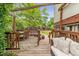 Cozy back deck featuring ample seating, dining area, and views of the lush backyard at 5987 W Ken Caryl Pl, Littleton, CO 80128