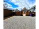 The backyard features a gravel area and a wooden fence, offering a blend of textures at 52 S Washington St, Denver, CO 80209