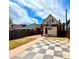 Charming home featuring a delightful backyard with a unique checkerboard patio and cozy outdoor space at 52 S Washington St, Denver, CO 80209
