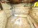 Unfinished basement featuring bare brick and concrete, offering a blank canvas for customization at 52 S Washington St, Denver, CO 80209