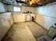Unfinished basement with a small window, offering potential for storage or customization at 52 S Washington St, Denver, CO 80209