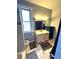 Bathroom with marble floor, modern vanity, and a tiled shower at 52 S Washington St, Denver, CO 80209