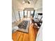 Bedroom with hardwood floors, a desk, and French doors leading to a balcony at 52 S Washington St, Denver, CO 80209
